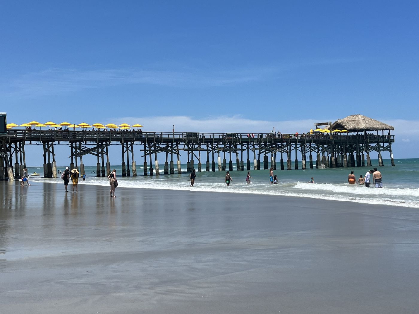 The wooden Cocoa Beach pier extending over the Atlantic.