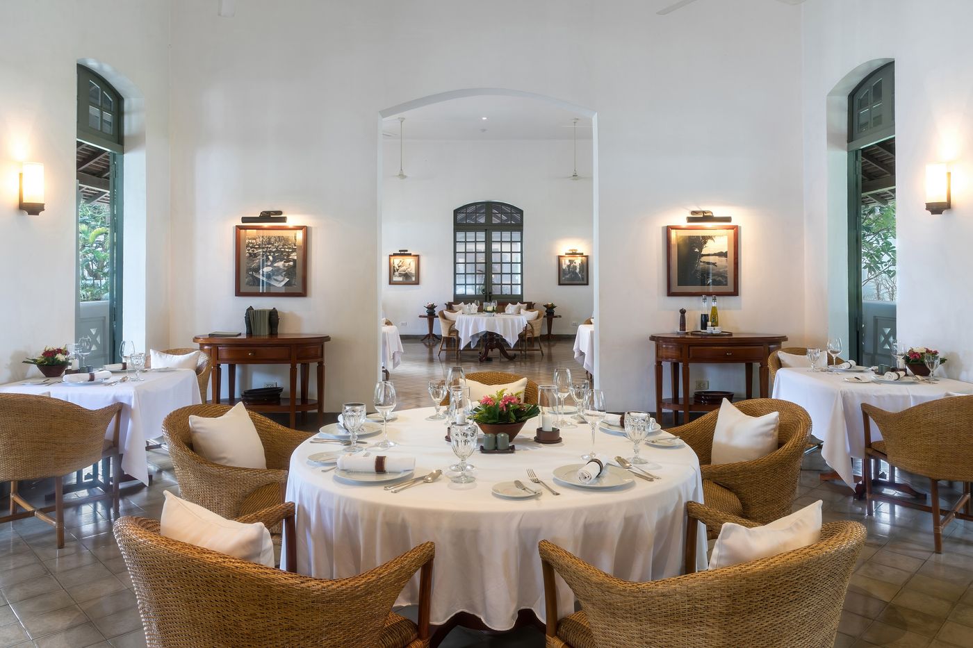 A white-clothed restaurant table laid for dinner.