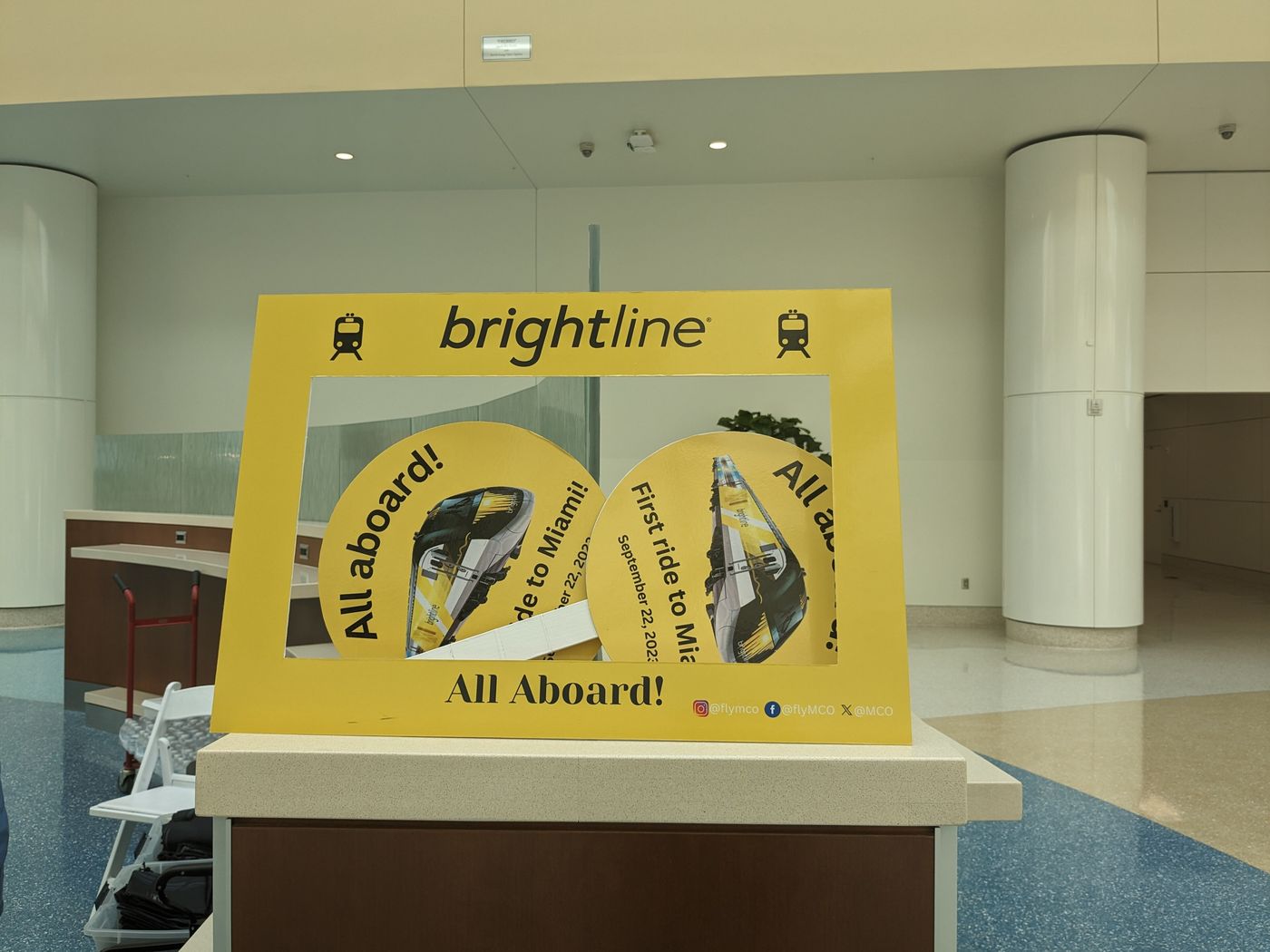 A Brightline information stand inside Orlando International Airport.